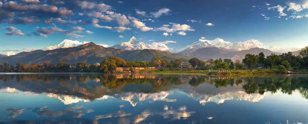 Incredible Himalayas. Panoramic view of Phewa lake from the lakeside at the foothills of the magnificent Annapurna mountain range.