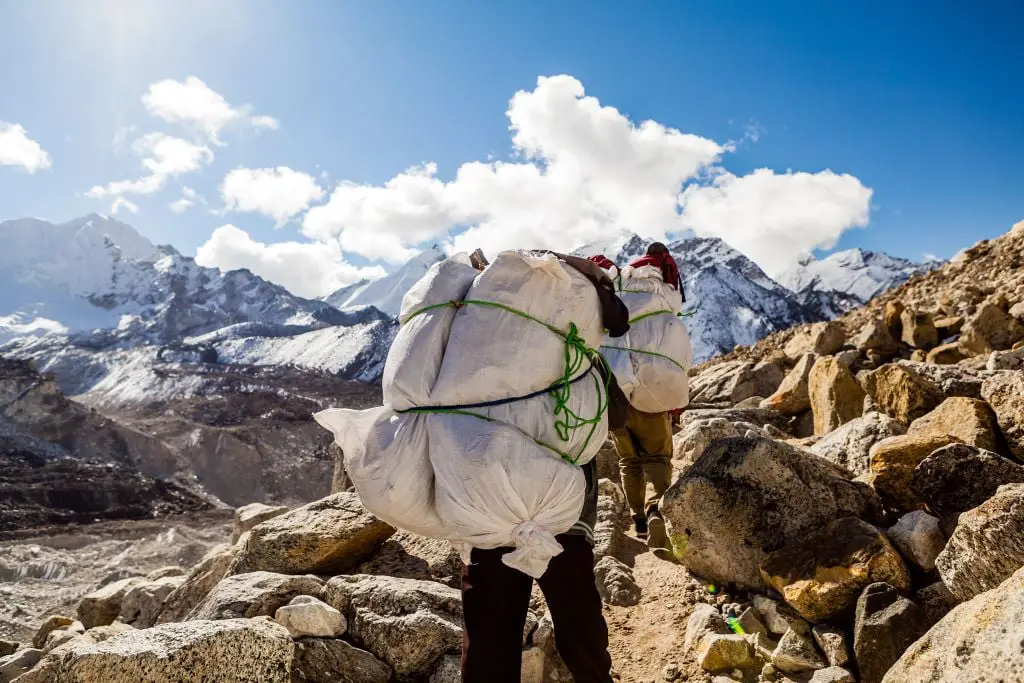 Sherpas carrying supplies to the peaks