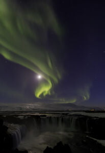 Aurora borealis in over natural landscape - northern lights