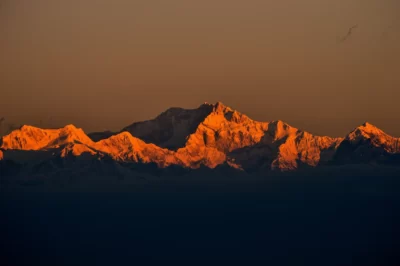 Kangchenjunga, also spelled Kanchenjunga, Kanchanjanghā and Khangchendzonga, is the third-highest mountain in the world. Its summit lies at 8,586 m (28,169 ft) in a section of the Himalayas